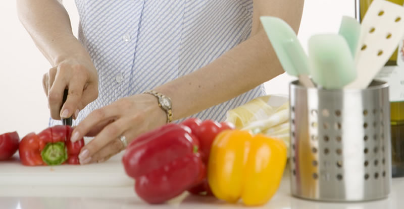 Woman cutting pepper